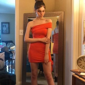 Body conscious dress in orange.